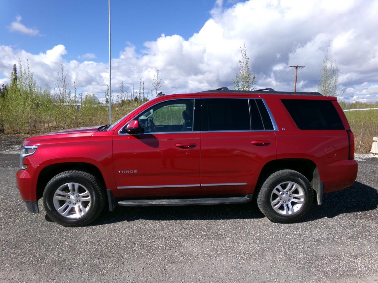 2015 Red Chevrolet Tahoe LT 4WD (1GNSKBKC8FR) with an 5.3L V8 OHV 16V engine, 6-Speed Automatic transmission, located at 2630 Philips Field Rd., Fairbanks, AK, 99709, (907) 458-0593, 64.848068, -147.780609 - Photo#2